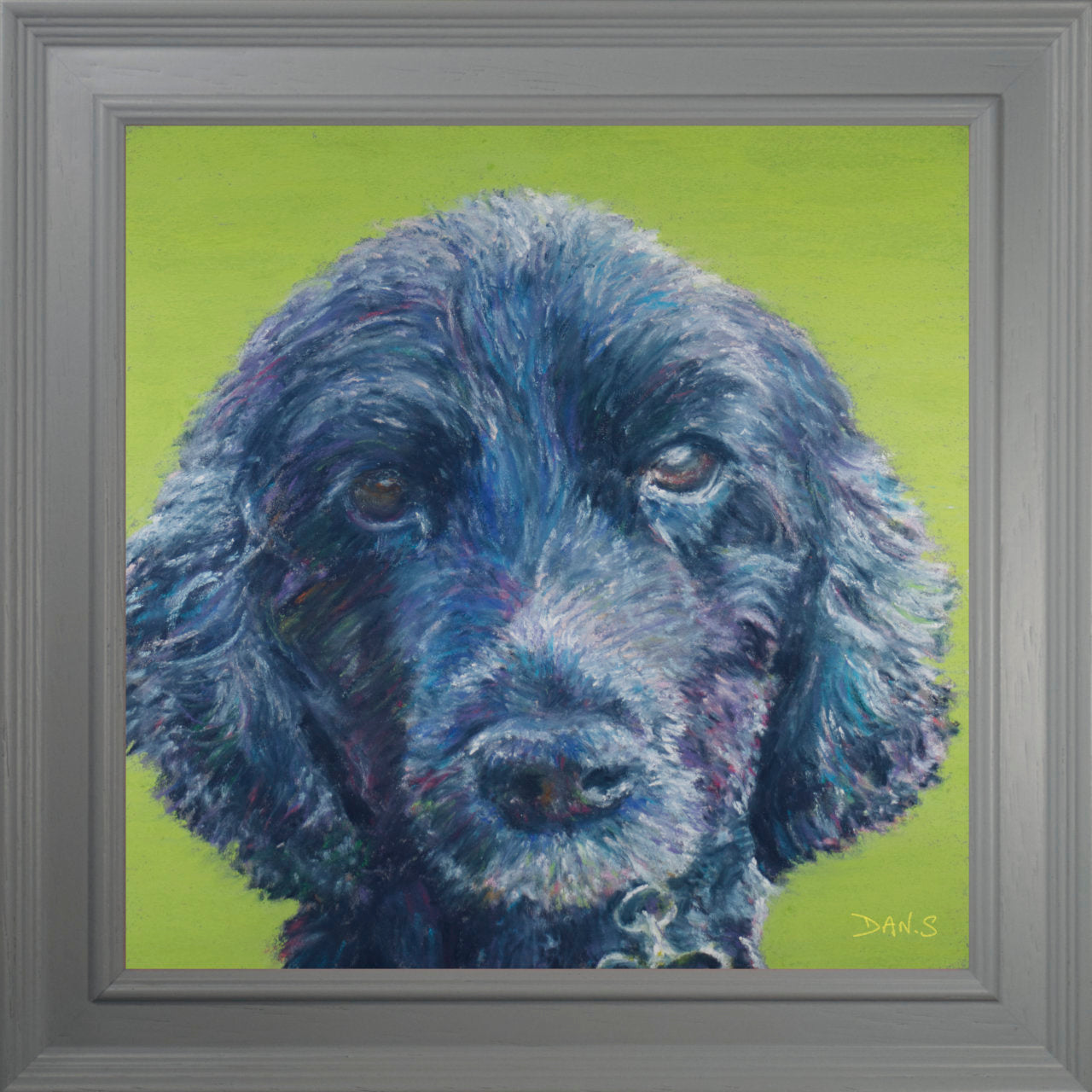 Picture of a black dog on a green background.