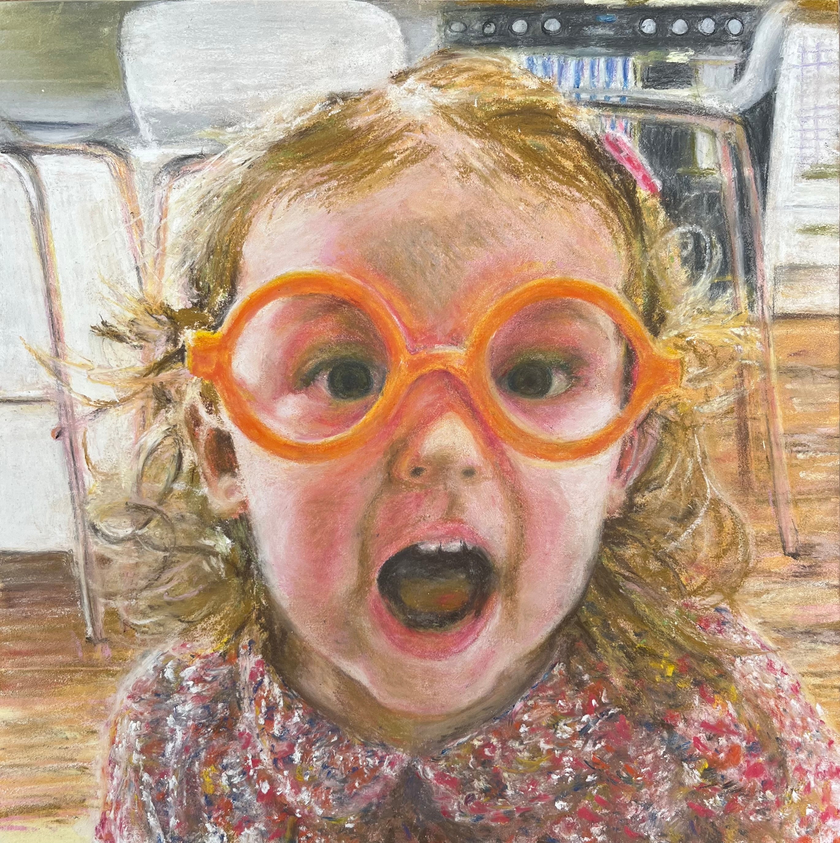 Child wearing large orange glasses with surprised expression