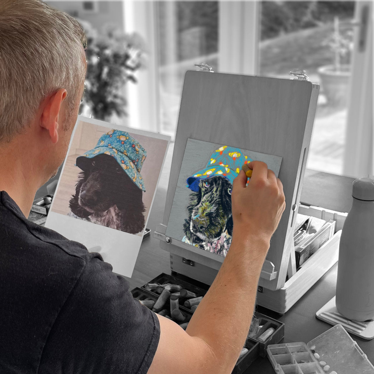 Person drawing a pastel picture