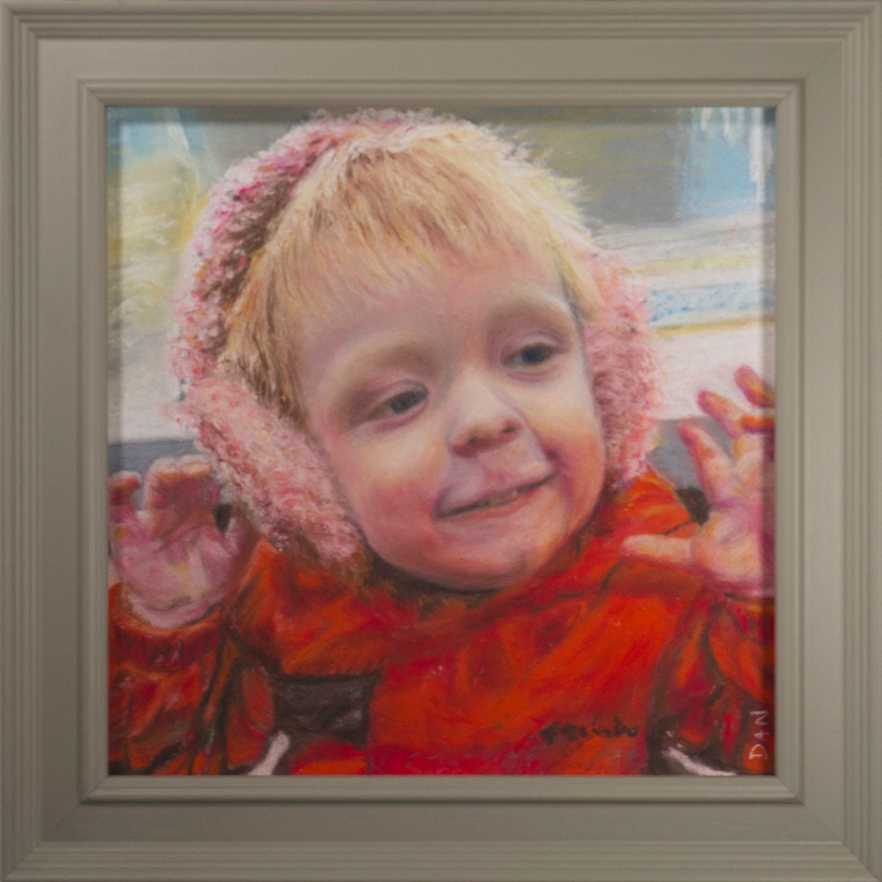 Framed pastel drawing of a child wearing a red coat and pink earmuffs