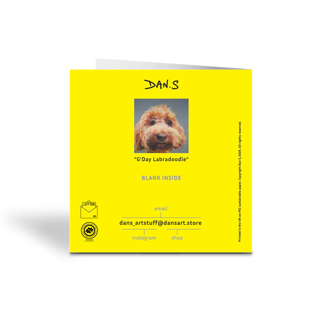 Back of a greetings card with a Australian Labradoodle face with a grey background 