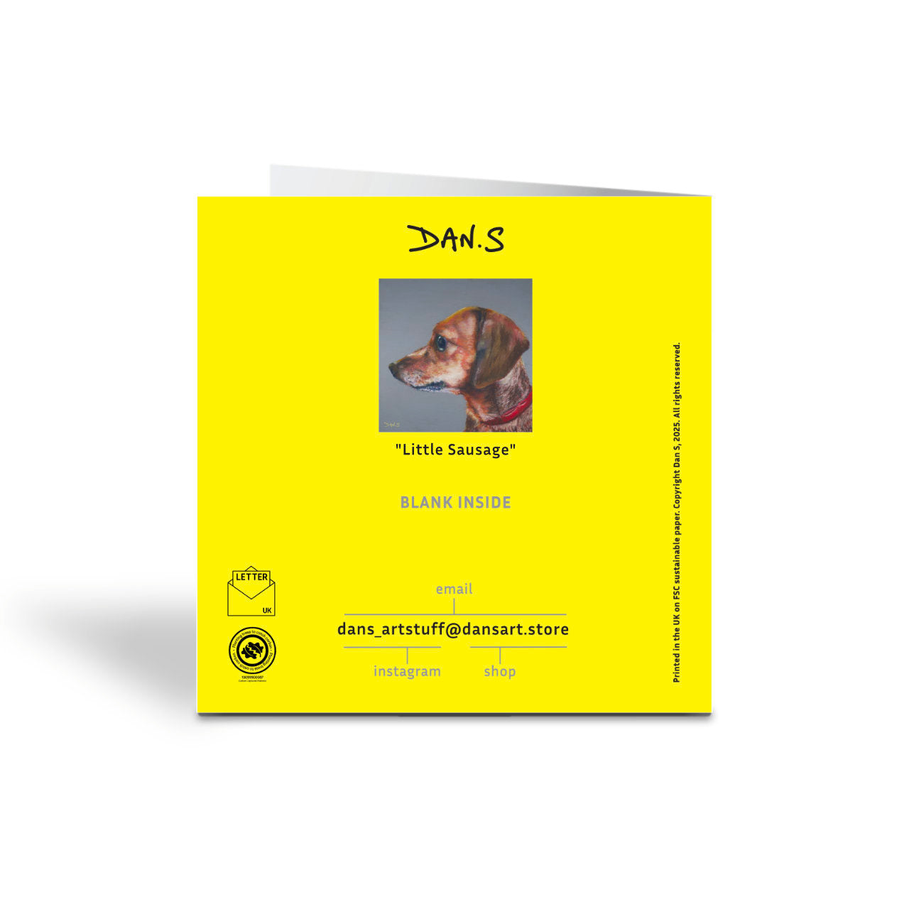 The back of a greetings card with a short haired dachshund's face with a grey background 