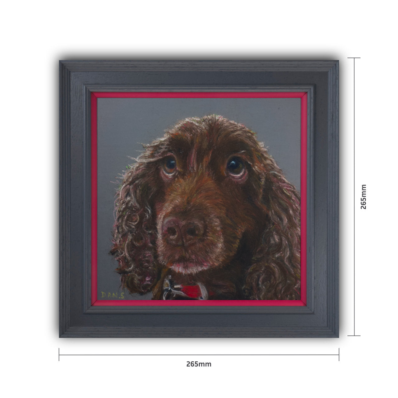 Picture of a brown cocker spaniel's face with a grey background in a grey frame with pink border