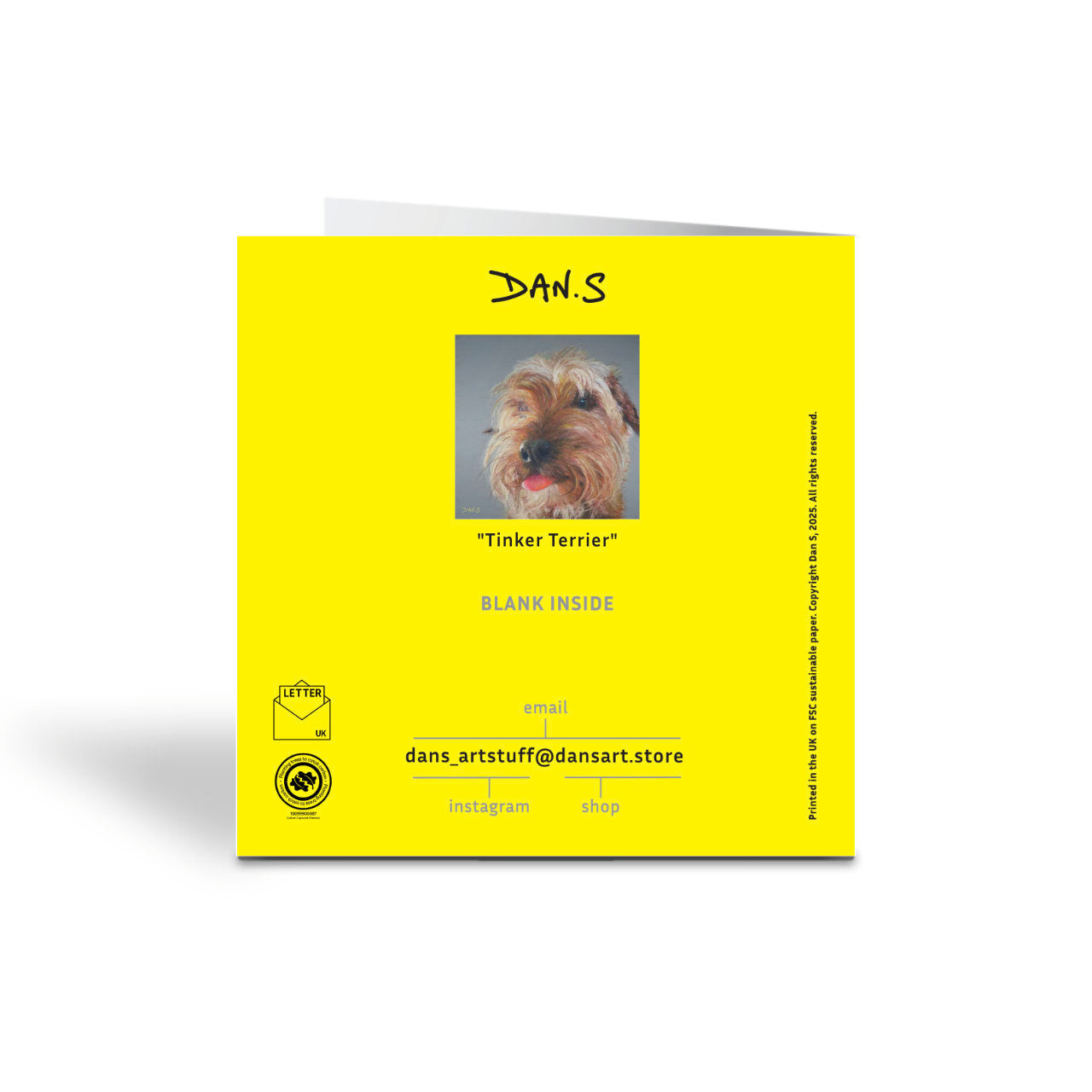 Picture of a terrier dog on a grey background on the back of a yellow greetings card